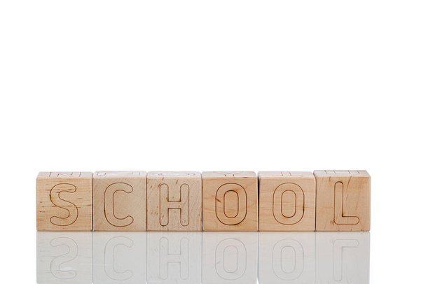 Wooden cubes with letters school on a white background close-up - Foto, Imagen