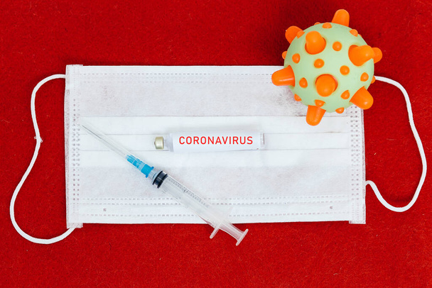 Abstract virus strain model of MERS-Cov or middle East respiratory syndrome coronavirus and Novel coronavirus 2019-nCoV with text on a red felt background. Pandemic Protection Concept - Valokuva, kuva