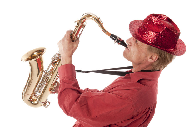 Homme jouant du saxophone avec dévotion
 - Photo, image