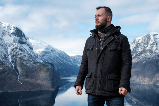 Man at Stegastein viewpoint above Aurlandsfjord in Norway - Valokuva, kuva