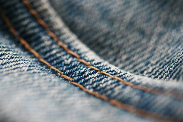 Jeans denim texture close up , focus only one point , soft blured background wallpaper - Photo, Image