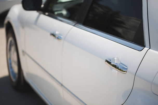 White Car with Silver Car Door Handle. - Foto, afbeelding