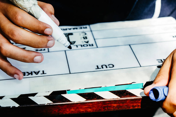 Film Slate, close up image of film production crew holding Film Slate on set - Fotoğraf, Görsel