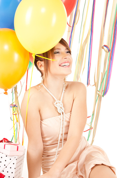 Party girl with balloons and gift box - Foto, imagen