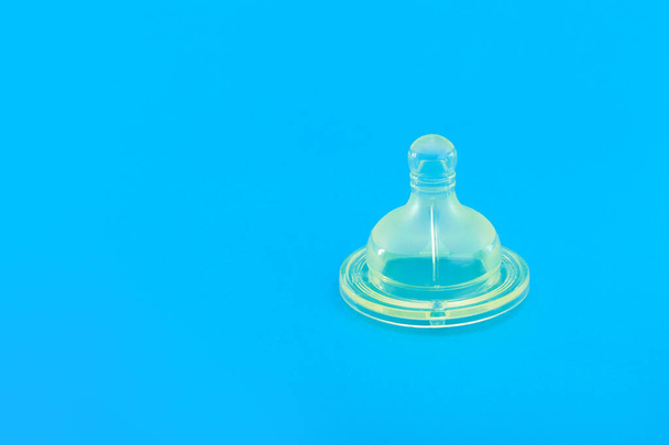 silicone pacifier for baby feeding bottle, baby health care object isolated on blue background with copy space, nobody. - 写真・画像