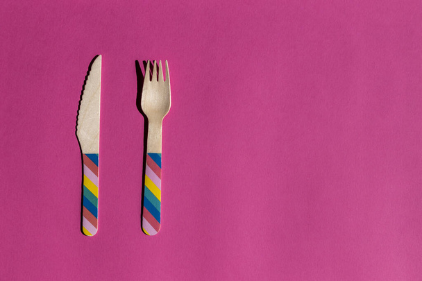 cutlery set with LGTBI motifs on pink background. conceptual image with copy space - Фото, изображение