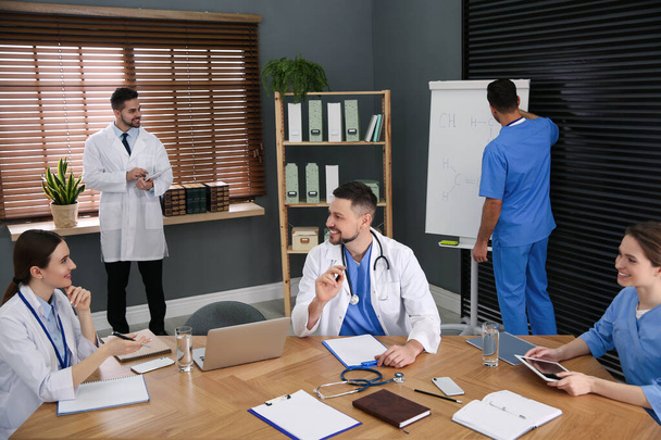 Team of professional doctors having meeting in office - Photo, Image