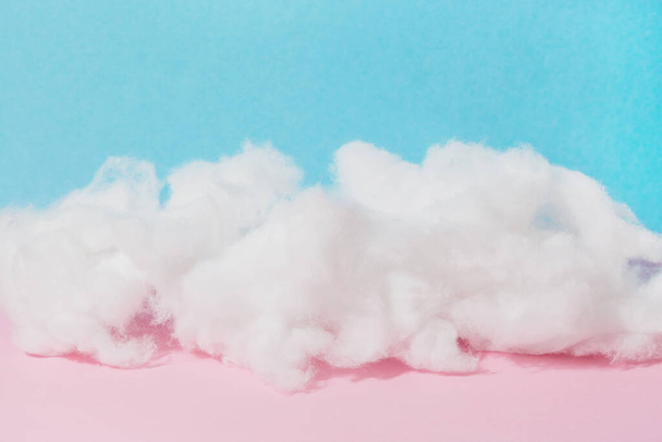 soft cotton wool cloud on pink and blue background, copy space, horizontal banner - Photo, Image