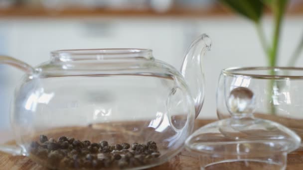 Method of brewing green tea in a transparent glass teapot - Video, Çekim