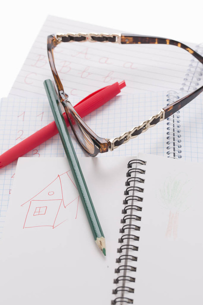 exercise book, pen, glasses, eraser  - Photo, Image