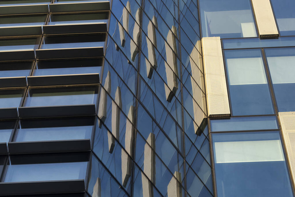Milan, Lombardy, Italy: modern buildings in Alvar Aalto square. Reflections - Foto, afbeelding
