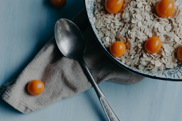 cape gooseberry and oatmeal raw - 写真・画像
