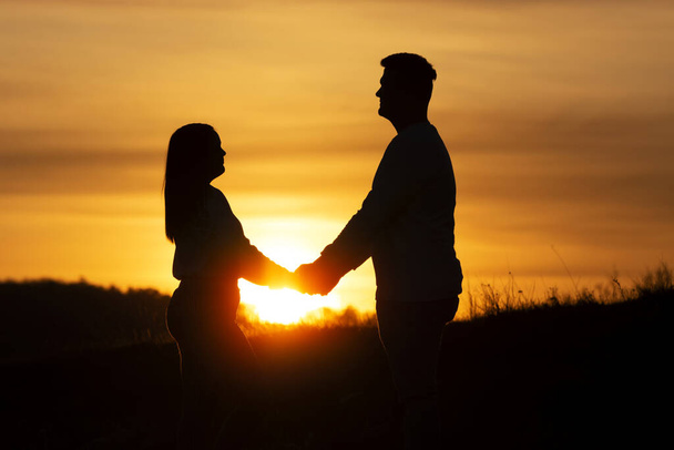 Loveing couple in sunset time in nature - Foto, immagini