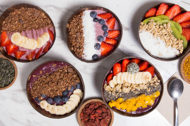 Tasty appetizing smoothie acai bowls. Top view.  Served in bowl. Healthy life clean eating concept - Photo, Image