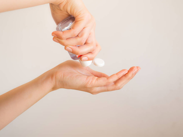 Female hands cleaning with sanitizer gel - 写真・画像