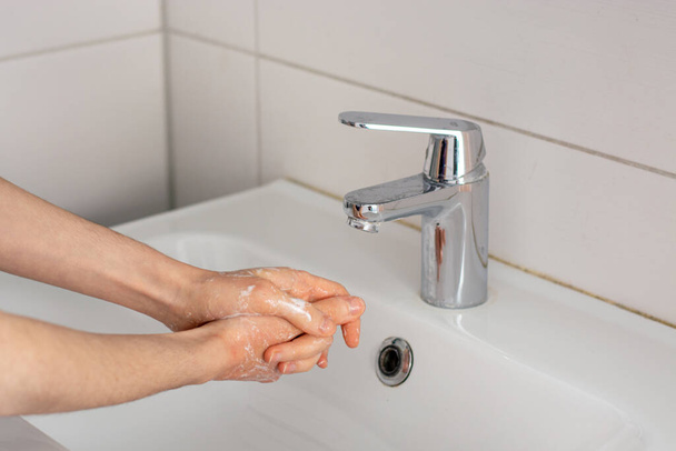 Soaping the hands before washing under tap water close up - Foto, Imagem