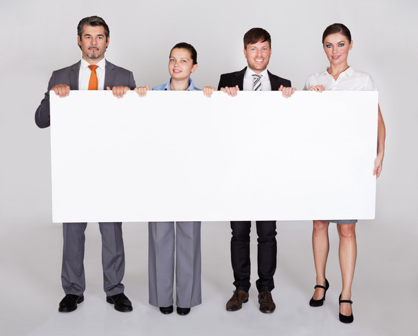 Businesspeople Holding Placard - Foto, Imagem