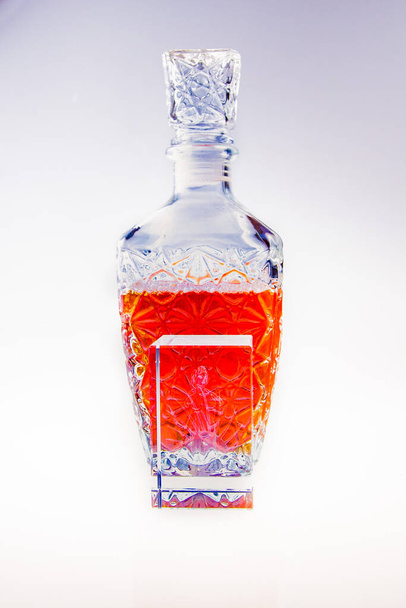 A bottle of cognac on white background - Foto, afbeelding