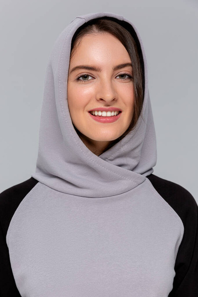 Woman in black and gray mini hoodie, mockup for logo or branding design - Zdjęcie, obraz
