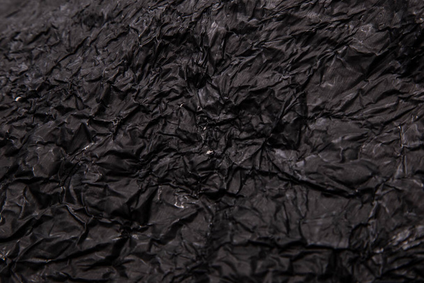 Fekete háttér. Gyűrött textúra. Közelkép - Fotó, kép
