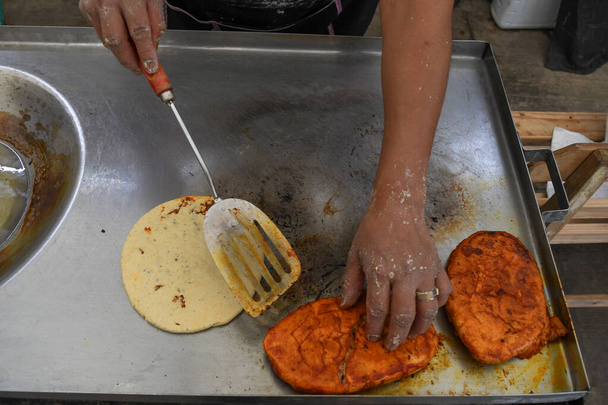 Photo of two hands preparing a typical mexican dishes - Photo, Image
