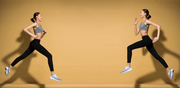 Asian slim Fitness kobieta ćwiczenia rozgrzewka rozciągnąć skoki sprężynowe nogi, studio oświetlenie żółty beżowy musztarda tło słońce cień przestrzeń kopia, koncepcja kobieta może zrobić sportowiec Sport 6 opakowania - Zdjęcie, obraz