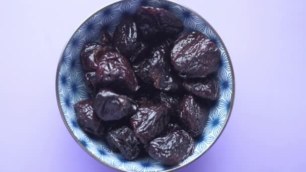 Fresh prunes in bowl. Prunes healthy food. Dried plums. - Footage, Video