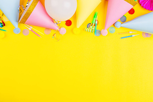 Birthday decor on yellow background, top view. Flat lay style. Mock up, template with copy space - Zdjęcie, obraz