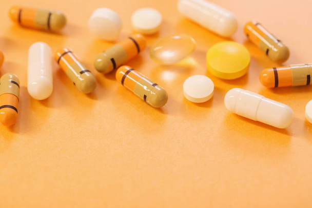 medicines  and pills on  orange  background - Foto, Imagem