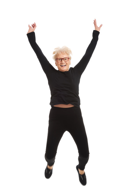 Happy old woman jumping. - Фото, зображення