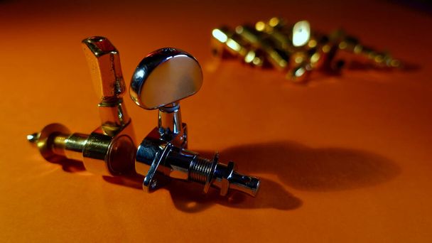 Guitar tuning pegs . Color background with copy space  - Фото, зображення