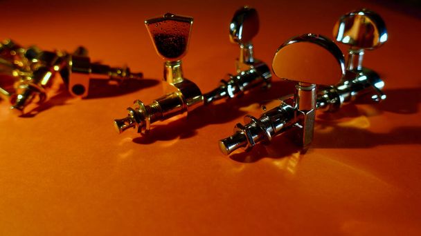 Guitar tuning pegs . Color background with copy space  - Photo, image
