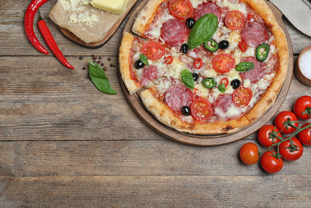 Delicious pizza Diablo on wooden table, flat lay. Space for text - Photo, Image