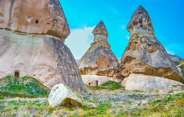 The unique tuff rock formations of Pigeon Valley include ancient cut cells, homes, shelters, cellars, birdhouses and other preserved man made structures, Cappadocia, Turkey - Fotoğraf, Görsel