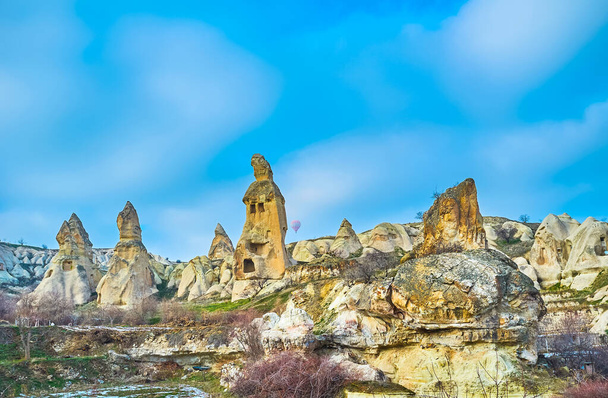 Explore the ancient cells, cut in tuff rock formations of Pigeon Valley, Cappadocia, Turkey - Fotoğraf, Görsel