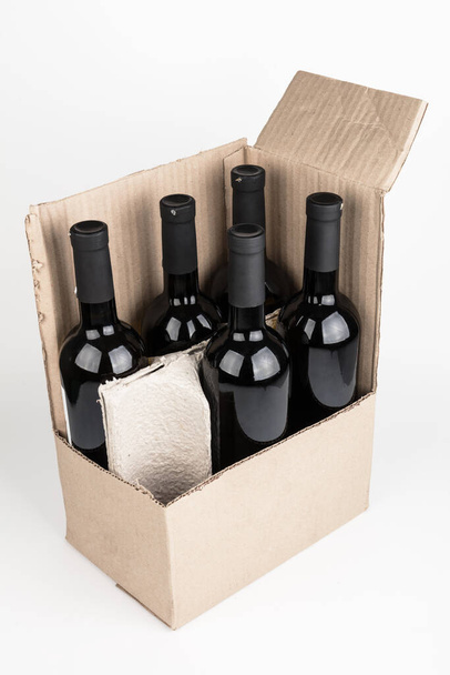 wine bottles in a box on a white background - Fotó, kép
