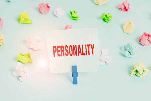 Text sign showing Personality. Conceptual photo combination characteristics that form individuals character Colored crumpled papers empty reminder blue floor background clothespin. - Photo, Image