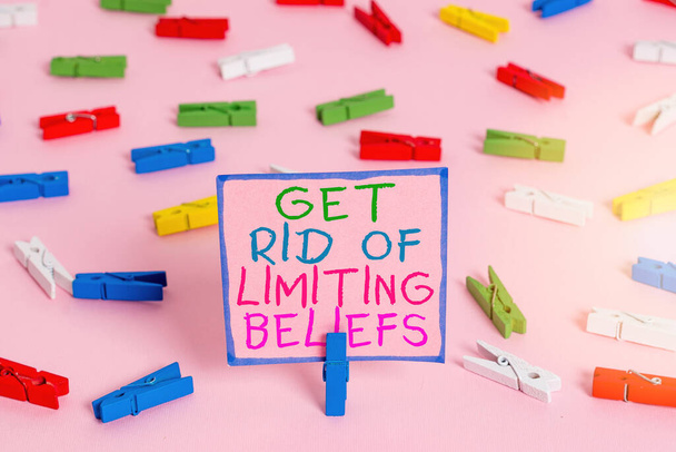 Word writing text Get Rid Of Limiting Beliefs. Business concept for remove negative beliefs and think positively Colored clothespin papers empty reminder pink floor background office pin. - Photo, Image