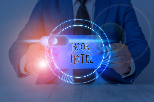 Writing note showing Book Hotel. Business photo showcasing an arrangement you make to have a hotel room or accommodation. - Photo, Image