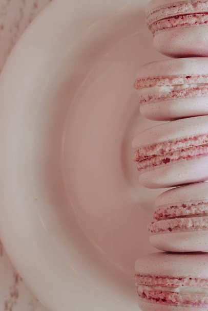 Strawberry macarons closeup. Fresh and colourful on pink background - Fotó, kép