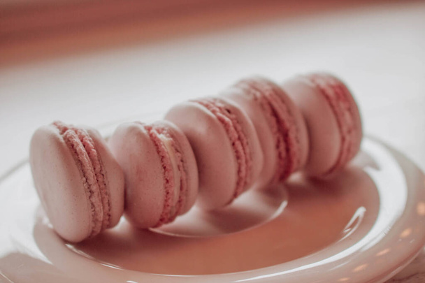 Strawberry macarons closeup. Fresh and colourful on pink background - Zdjęcie, obraz