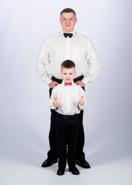 art director. father and son in formal suit. little boy with dad businessman. family day. esthete. male fashion. happy child with father. business meeting party. tuxedo style. art director concept - Foto, Imagem