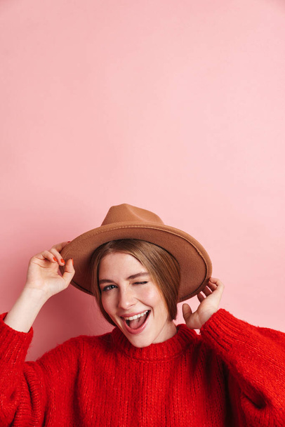 Image of positive young cute woman posing isolated over pink wall background. - Foto, afbeelding