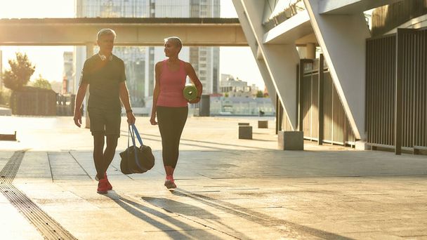 We care about our health. Senior couple in sports clothing going to exercise together outdoors - Fotoğraf, Görsel