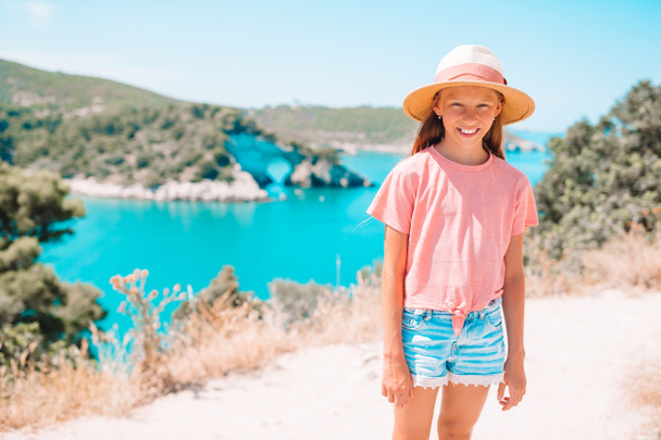 Little girl on vacation travel background beautiful landscape - Photo, Image