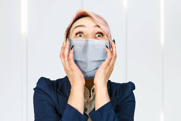 young girl amazed wearing protective face mask prevent virus infection, pollution. - Foto, imagen