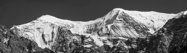 A panorama of the snow covered mountains of the Himalaya Mountain Range in Nepal. Trekking in the mountains of northern Nepal. - Photo, Image