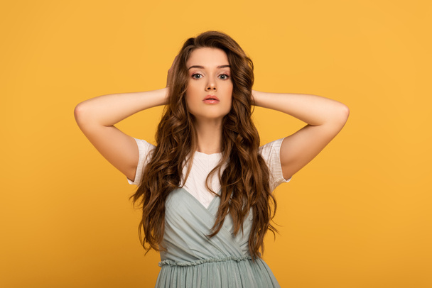 attractive spring woman with long hair isolated on yellow - Fotoğraf, Görsel