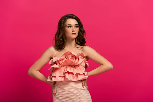beautiful confident woman standing in elegant dress on pink  - Foto, Imagem