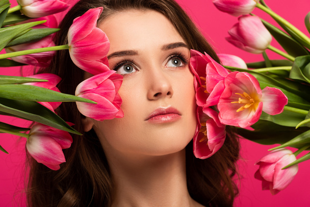 beautiful girl with spring tulip flowers isolated on pink - Fotoğraf, Görsel